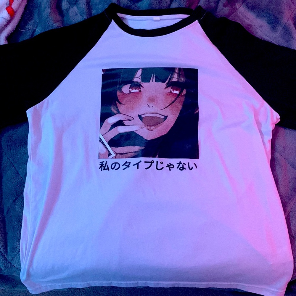 Small, black and white anime shirt.